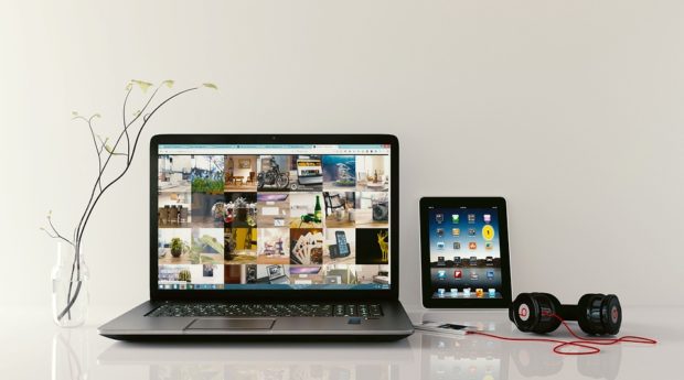 laptop, a tablet and Beats headphone