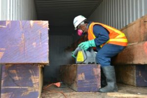 man cutting stuffs